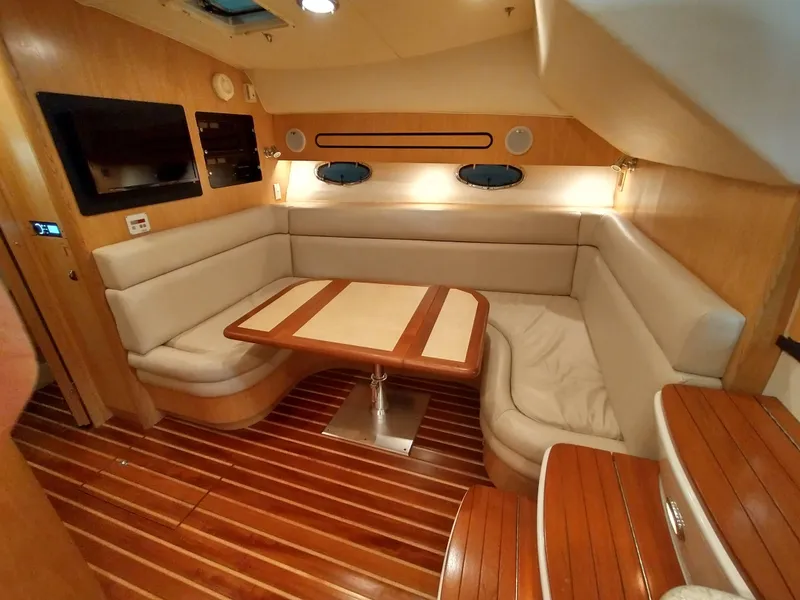 Slide: The Image of Interior of 2001 Tiara Yachts 3800 Open with elegant seating area. - 7