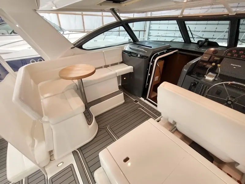 Slide: The Image of Interior of a 2001 Tiara Yachts 3800 Open with elegant furnishings. - 8