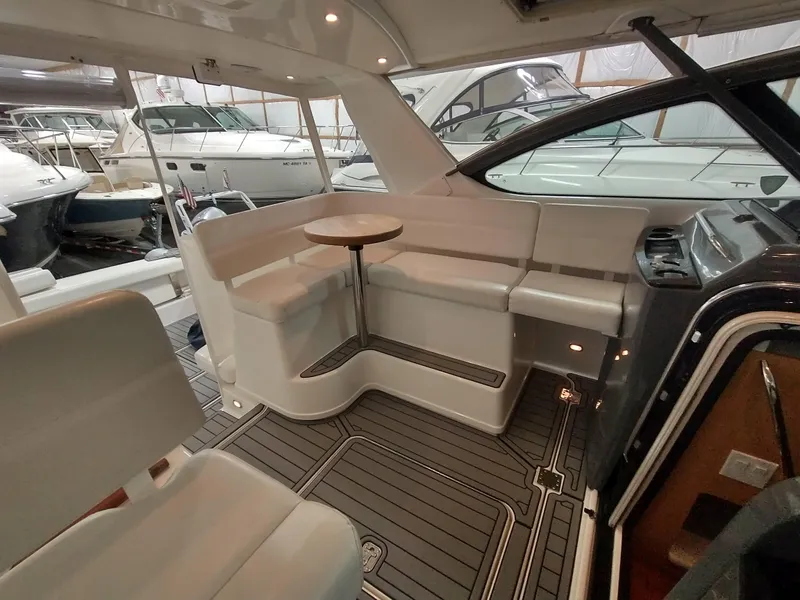 Slide: The Image of Interior of a 2001 Tiara Yachts 3800 Open with seating area. - 9