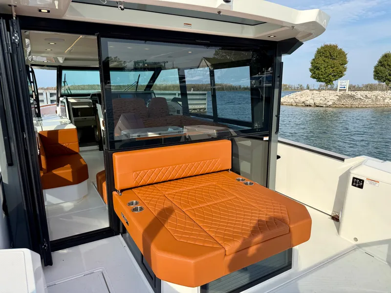 Slide: The Image of The image shows the deck of a Saxdor 400 GTC with orange seating. - 7