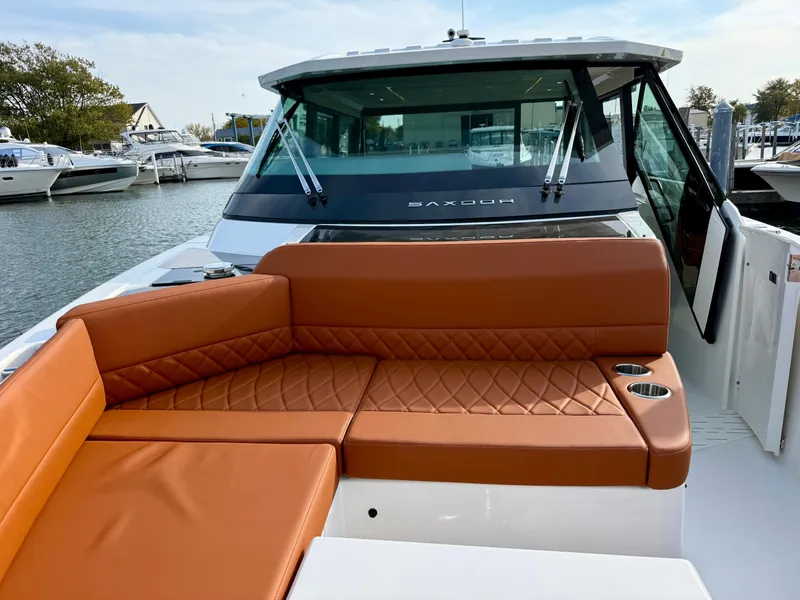 Slide: The Image of The image shows the deck of a Saxdor 400 GTC with brown upholstery and a modern design. - 26