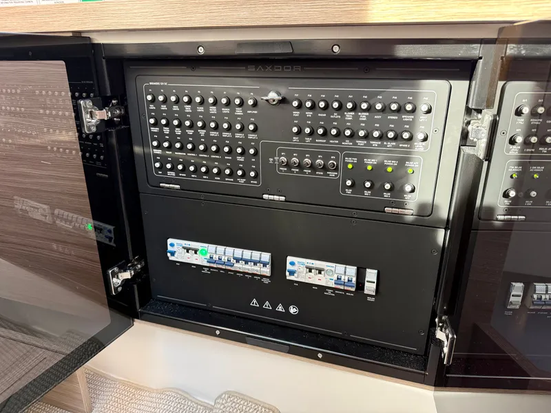 Slide: The Image of Electrical control panel on a Saxdor 400 GTC boat, featuring numerous switches and indicators. - 32
