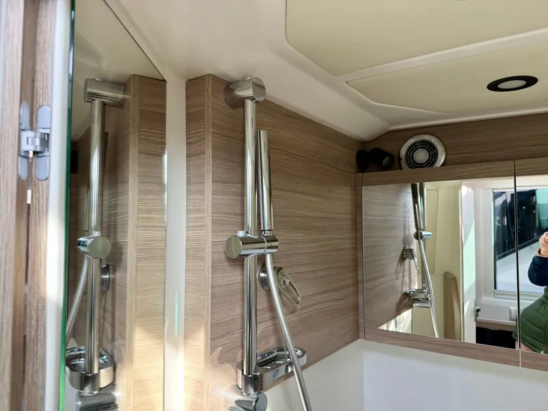 Slide: The Image of Modern boat shower with wood paneling and mirrors. - 34