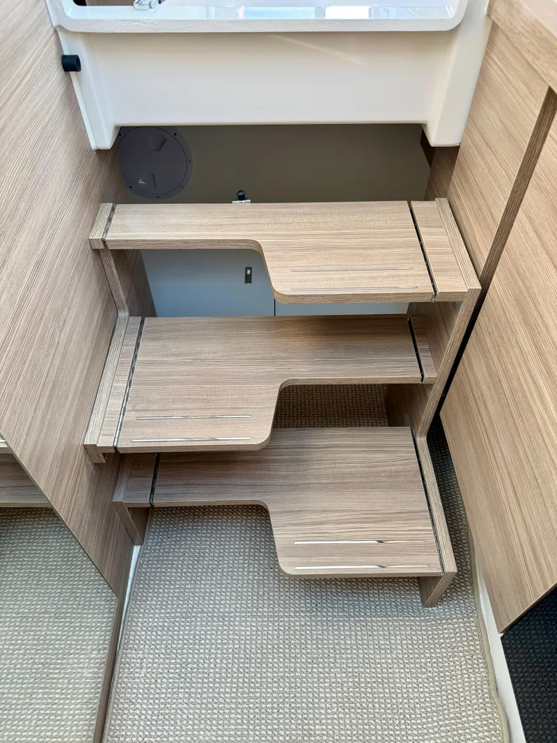 Slide: The Image of Wooden staircase with a modern design in a boat, leading to an upper area. - 35
