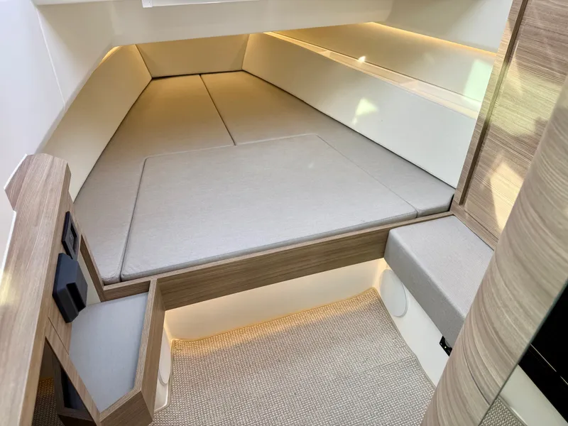 Slide: The Image of Interior of a 2027 Saxdor 400 GTC with sleek, modern upholstery and wood paneling. - 30