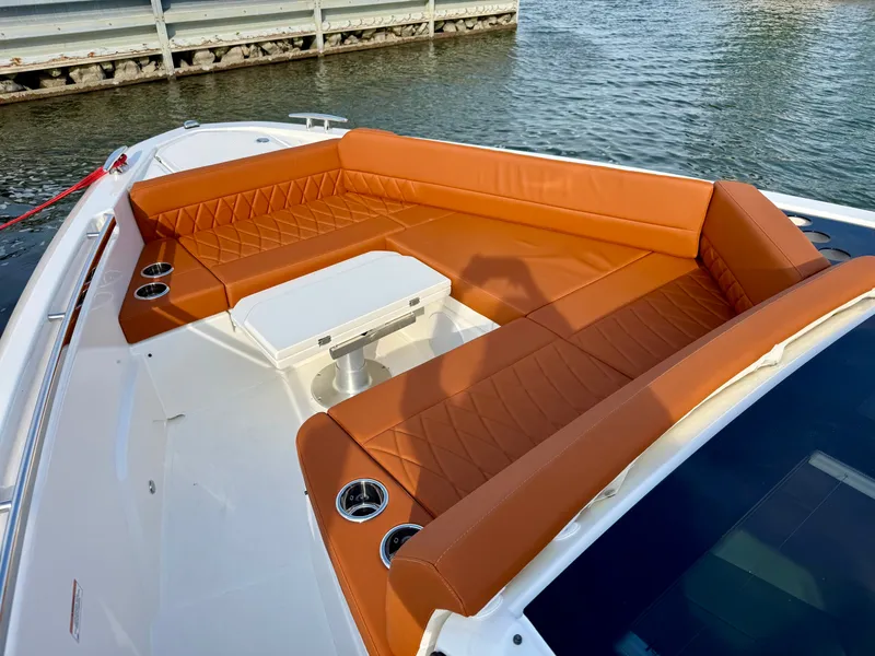 Slide: The Image of The image shows the deck of a Saxdor 400 GTC with orange cushions and a table. - 25