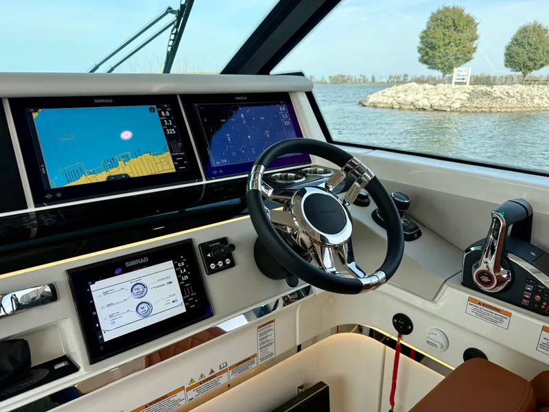 Slide: The Image of The 2027 Saxdor 400 GTC cockpit features modern navigation systems and a sleek steering wheel. - 16