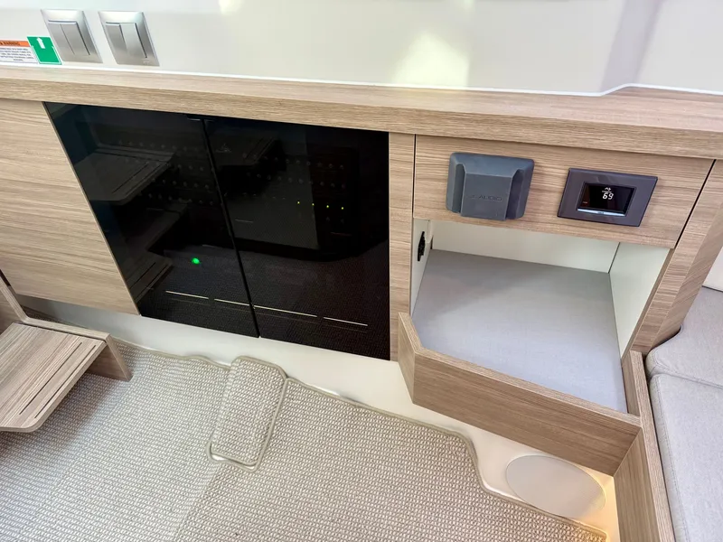 Slide: The Image of Interior of the Saxdor 400 GTC featuring modern wood paneling and built-in appliances. - 36