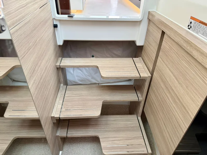 Slide: The Image of Wooden steps in a modern boat with light-colored interior. - 37