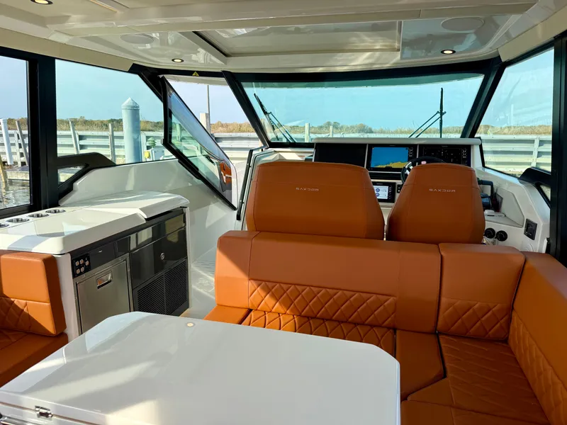 Slide: The Image of Interior of the Saxdor 400 GTC with brown leather seating and modern helm console. - 23