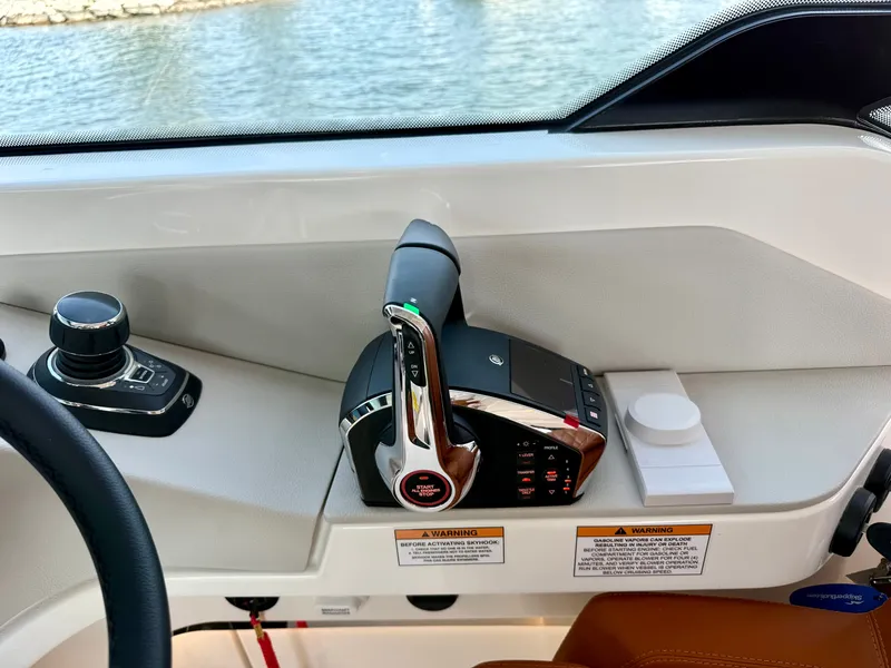 Slide: The Image of The image shows the helm of a Saxdor 400 GTC boat with modern controls. - 18