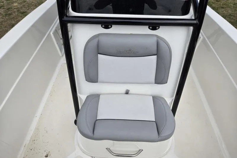 Slide: The Image of 2021 NauticStar 231 Hybrid boat seat with gray and white upholstery. - 3
