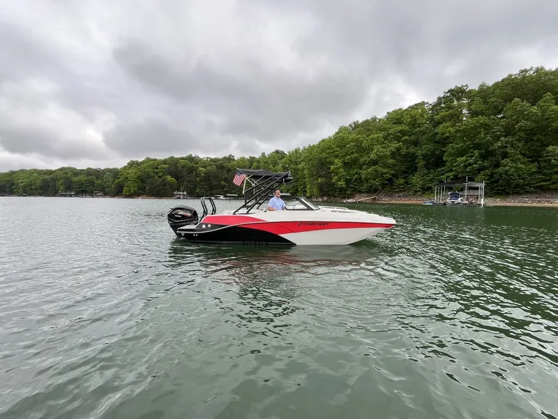 Slide: The Image of Starcraft SVX OB 230 DC OB 2025 on a tranquil lake. - 0
