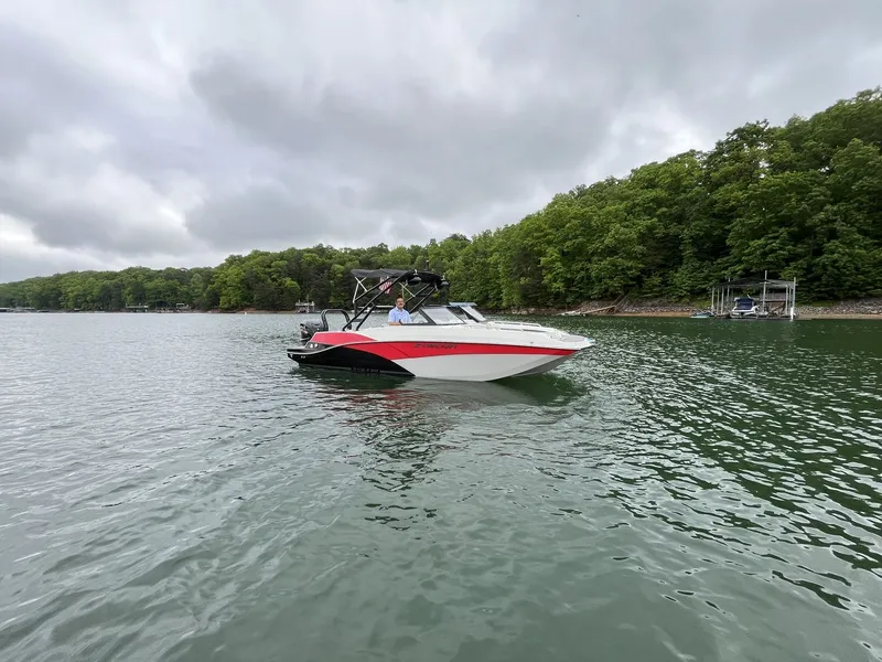 Slide: The Image of 2025 Starcraft SVX OB 230 DC boat on a lake. - 1