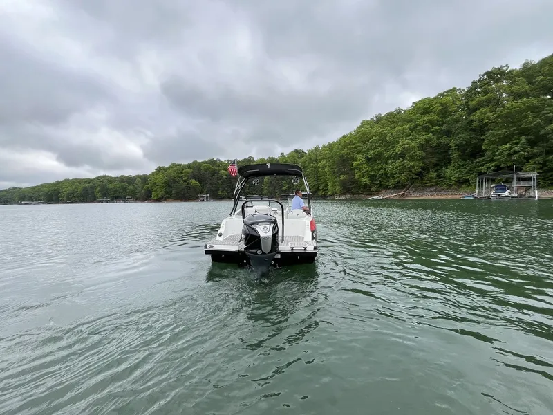 Slide: The Image of Starcraft SVX OB 230 DC OB 2025 on a tranquil lake. - 11