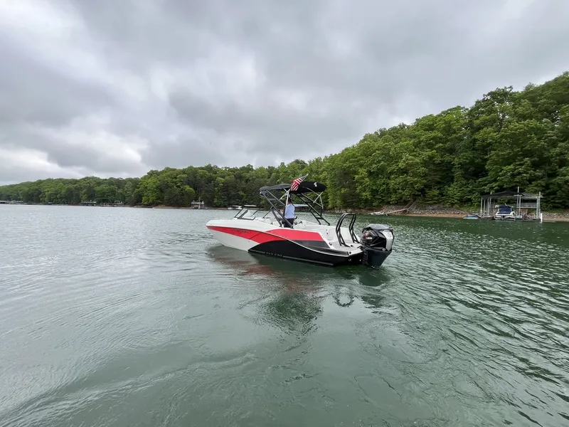Slide: The Image of 2025 Starcraft SVX OB 230 DC boat on a lake. - 14