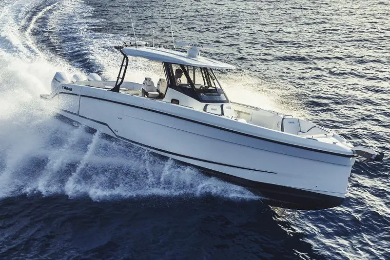 Slide: The Image of Manufacturer Provided Image: 2026 Wellcraft 38 T-Top boat cruising on open water, showcasing sleek design and performance. - 7
