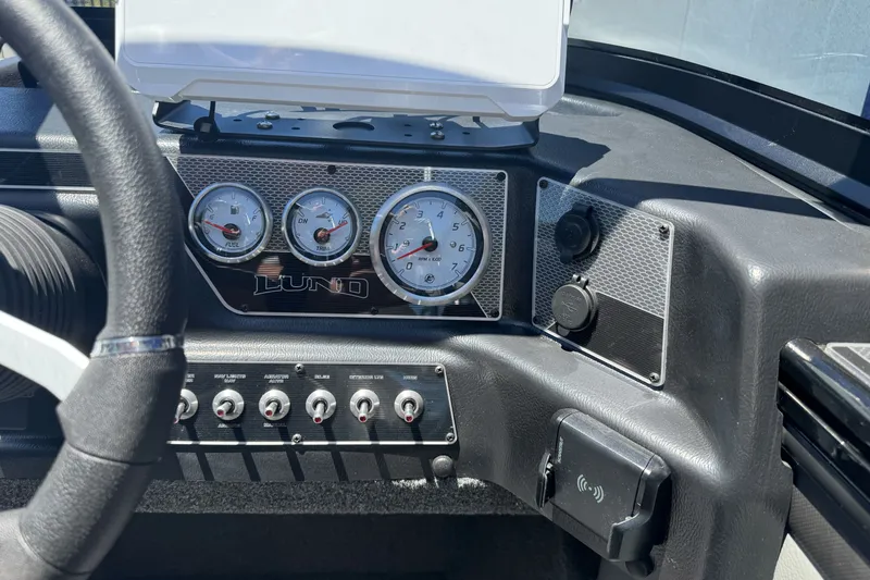 Slide: The Image of Dashboard of 2026 Lund 1875 Crossover XS boat with gauges and controls. - 13