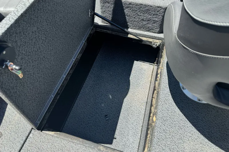 Slide: The Image of Open storage compartment in 2026 Lund 1875 Crossover XS boat interior. - 20