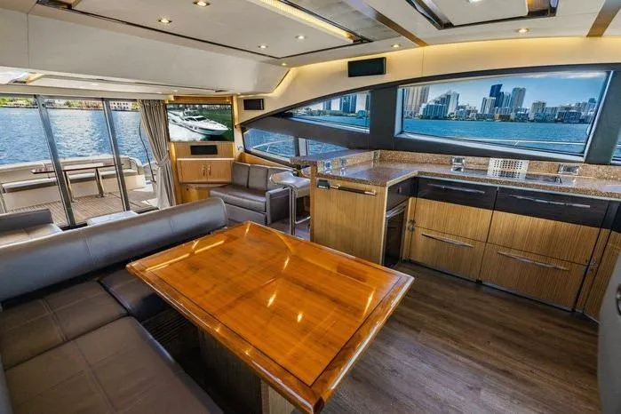 Slide: The Image of Luxurious interior of 2016 Sea Ray L650 Fly yacht with city skyline view. - 2