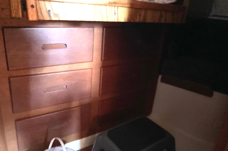Slide: The Image of Wooden drawers in a 1990 Tartan 372 interior, partially illuminated. - 24
