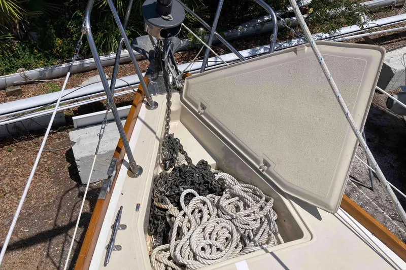 Slide: The Image of Open anchor locker on 1990 Tartan 372 sailboat, showing ropes and chains. - 29