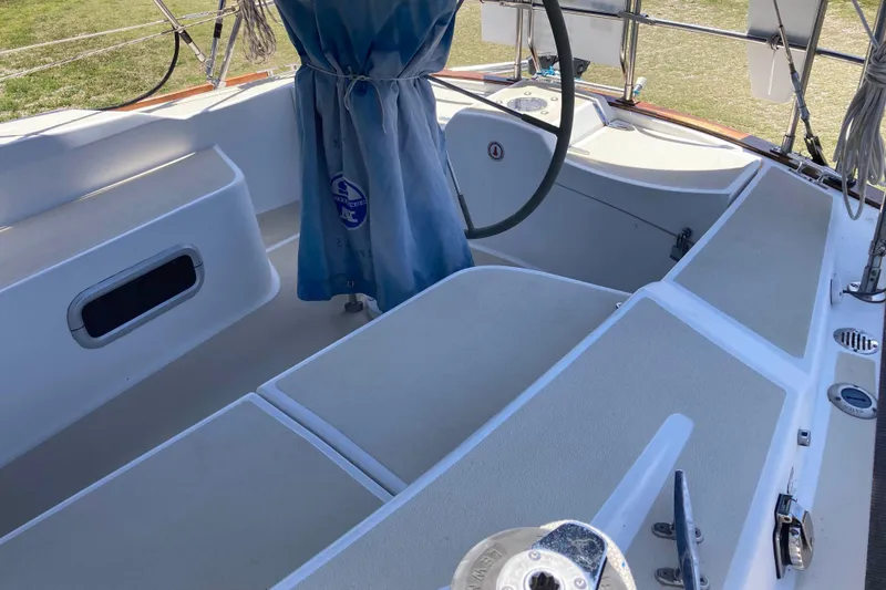 Slide: The Image of Cockpit of a 1990 Tartan 372 sailboat with steering wheel and seating. - 9