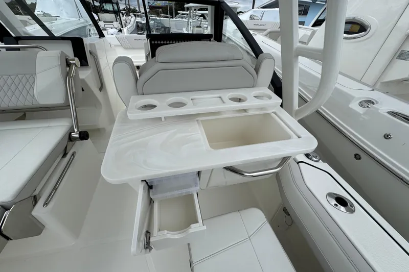 Slide: The Image of 2024 World Cat 260 DC-X boat interior with seating and storage compartments. - 14