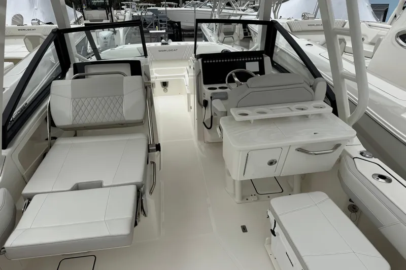 Slide: The Image of 2024 World Cat 260 DC-X boat interior with luxurious seating and modern helm design. - 16