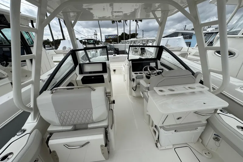 Slide: The Image of 2024 World Cat 260 DC-X boat interior with modern helm and seating. - 17