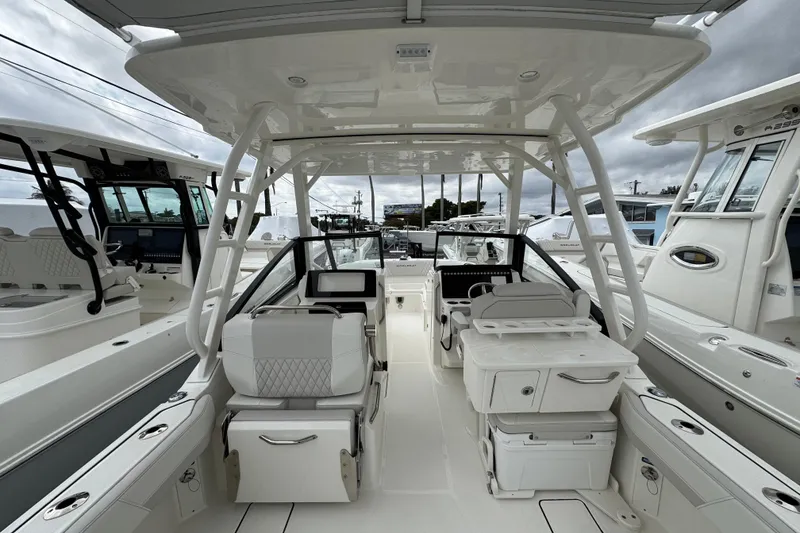 Slide: The Image of 2024 World Cat 260 DC-X boat interior, featuring sleek seating and modern amenities. - 20