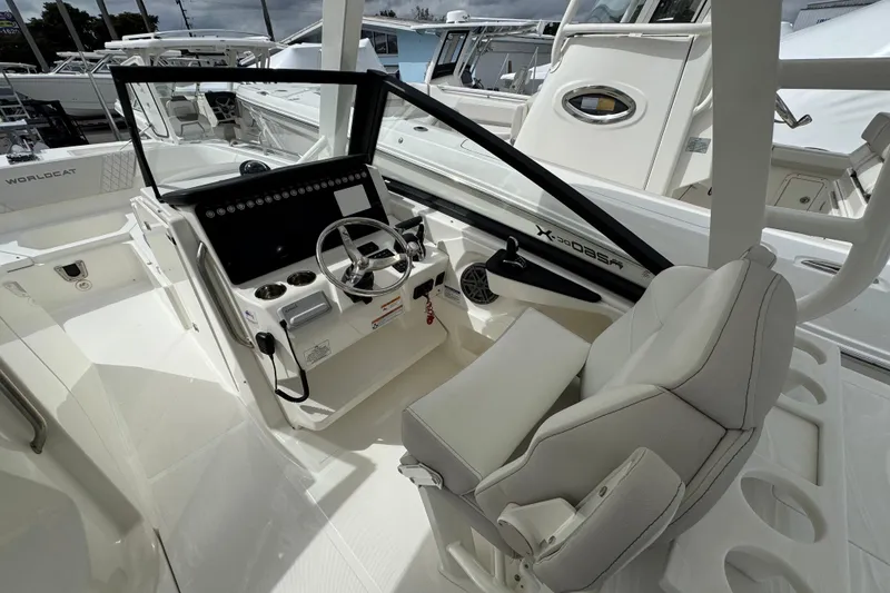 Slide: The Image of 2024 World Cat 260 DC-X boat interior with modern helm and comfortable seating. - 27