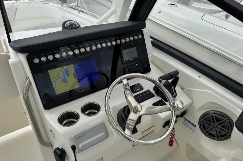 Slide: The Image of 2024 World Cat 260 DC-X helm with navigation display and steering wheel. - 30