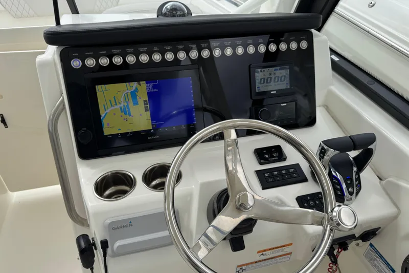 Slide: The Image of 2024 World Cat 260 DC-X dashboard with Garmin navigation and control panel. - 31