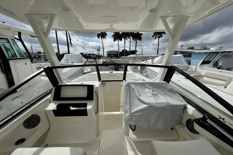 Slide: The Image of 2024 World Cat 260 DC-X boat interior with modern dashboard and seating. - 36