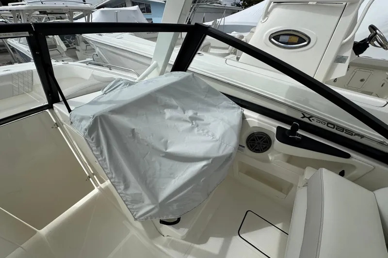 Slide: The Image of 2024 World Cat 260 DC-X boat interior with covered helm and seating area. - 37