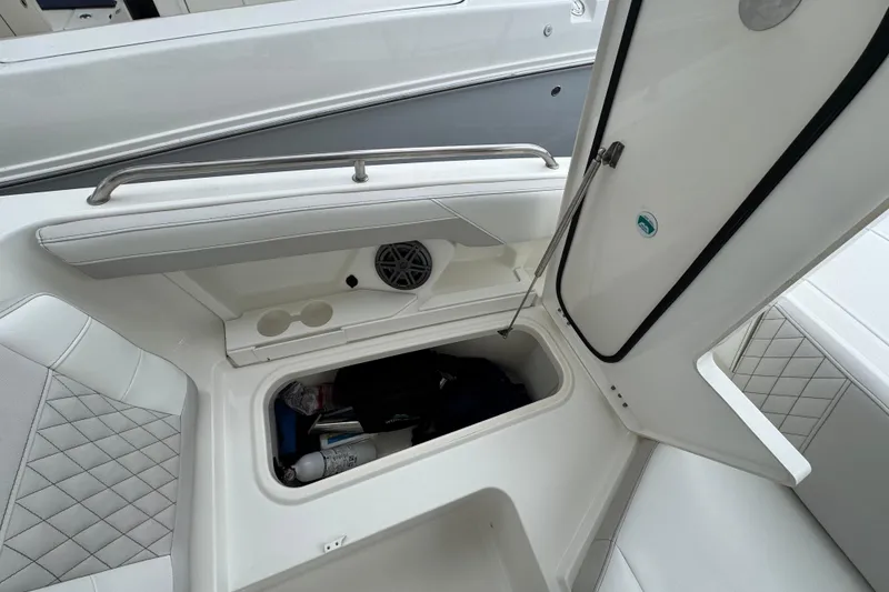Slide: The Image of 2024 World Cat 260 DC-X boat interior storage compartment open, showcasing spacious design. - 38