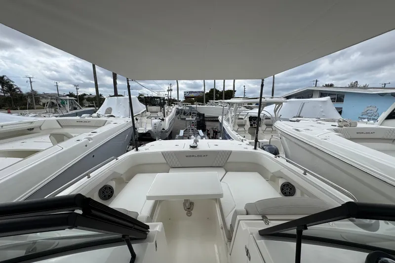 Slide: The Image of 2024 World Cat 260 DC-X boats displayed at a marina under cloudy skies. - 41