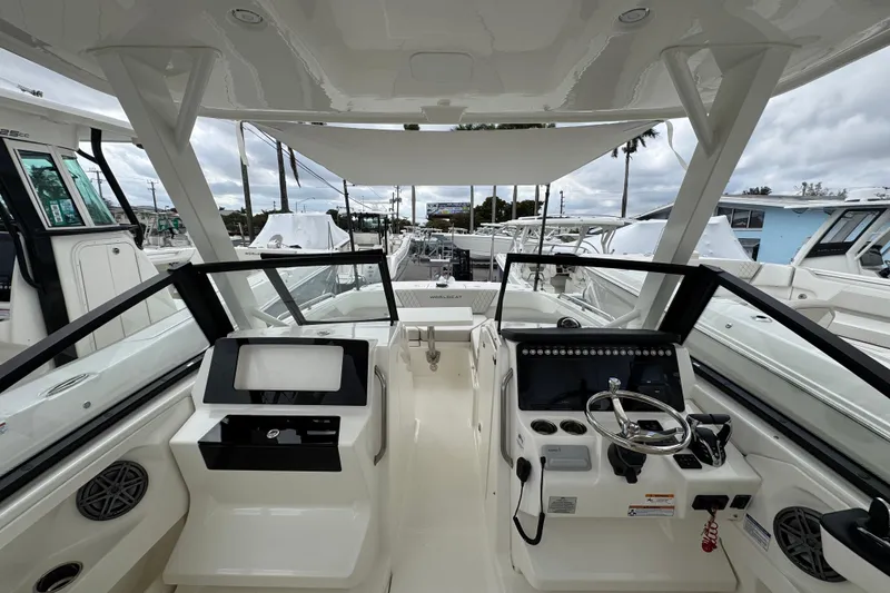 Slide: The Image of Interior view of 2024 World Cat 260 DC-X boat, showcasing helm and seating area. - 42