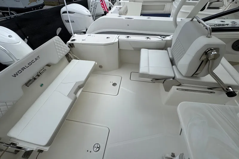 Slide: The Image of 2024 World Cat 260 DC-X boat interior with white seating and sleek design. - 45