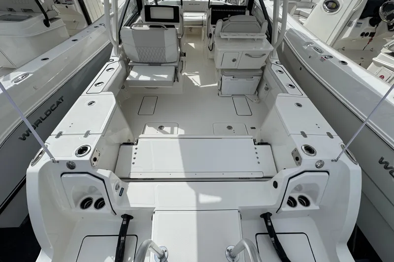 Slide: The Image of 2024 World Cat 260 DC-X boat interior with seating and storage compartments. - 46