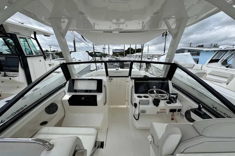 Slide: The Image of 2024 World Cat 260 DC-X boat interior with modern helm and seating. - 47