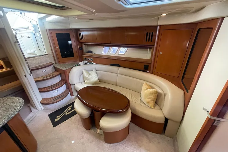 Slide: The Image of Luxurious interior of 2006 Sea Ray 44 Sundancer yacht with elegant seating and wooden finishes. - 28