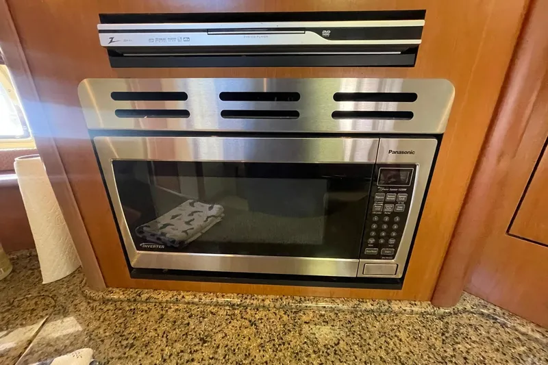 Slide: The Image of Built-in Panasonic microwave in 2006 Sea Ray 44 Sundancer in the galley. - 34