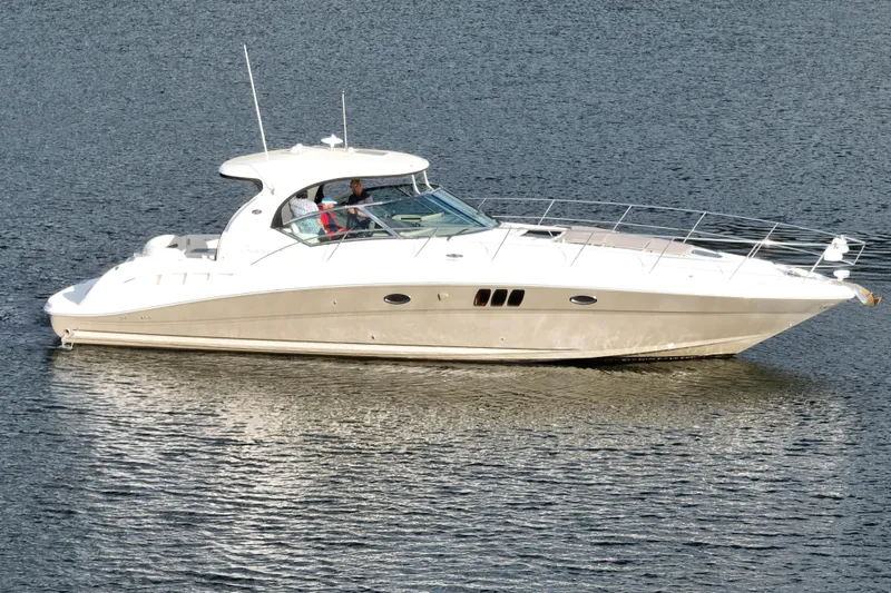 Slide: The Image of 2006 Sea Ray 44 Sundancer yacht cruising on calm waters. - 73