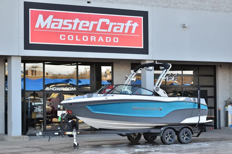 The Image of 2023 MasterCraft XT22 T boat displayed at MasterCraft Colorado showroom. - 1