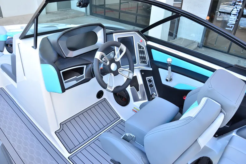 Slide: The Image of 2023 MasterCraft XT22 T boat interior with modern dashboard and steering wheel. - 10