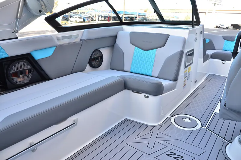 Slide: The Image of 2023 MasterCraft XT22 T boat interior with stylish seating and modern design. - 11