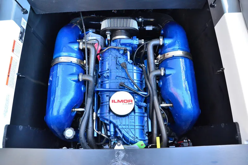 Slide: The Image of 2023 MasterCraft XT22 T engine with blue Ilmor components. - 14