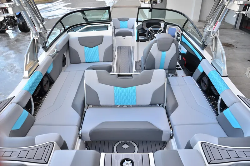 Slide: The Image of 2023 MasterCraft XT22 T boat interior with modern seating and sleek design. - 15